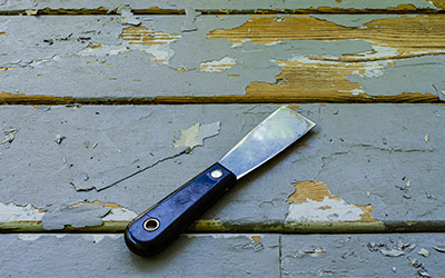 A Scrapper with black handle