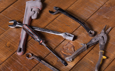 rusty tools on a wooden table