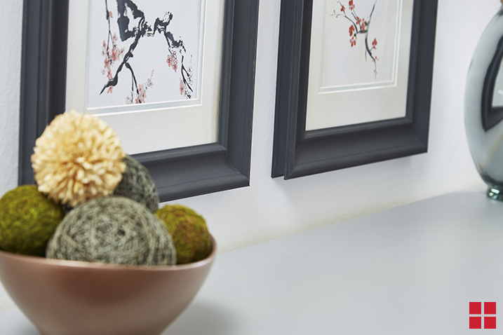 Wooden picture frames spray painted with Chalked Ultra Matte spray paint in Charcoal.